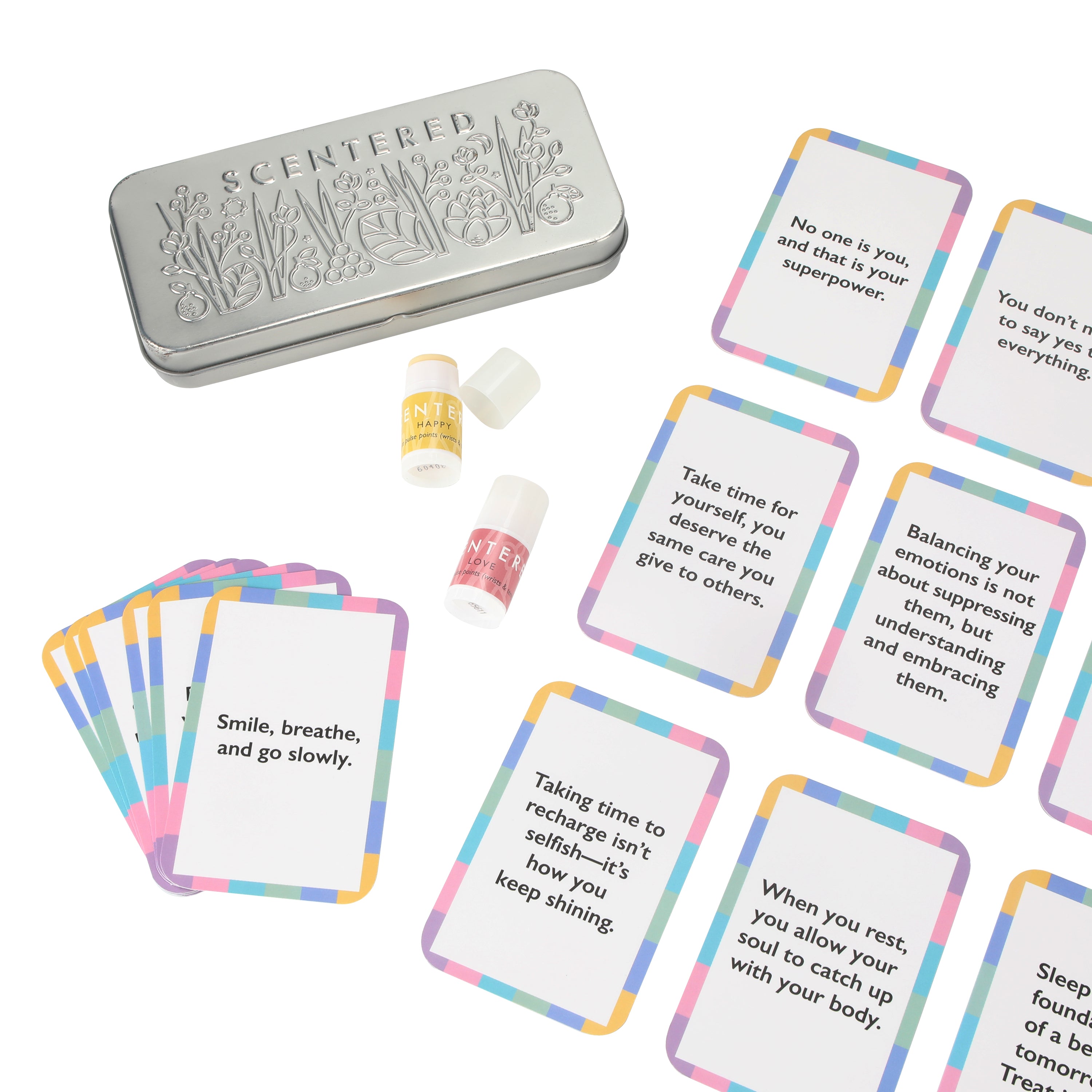 Set of cards with motivational phrases, two mini balms and a tin