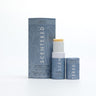 Focus Aromatherapy Balm with cap off and twisted up with eco sleeve packaging on a white background. Invigorating Focus Balm for Mental Clarity and Focus