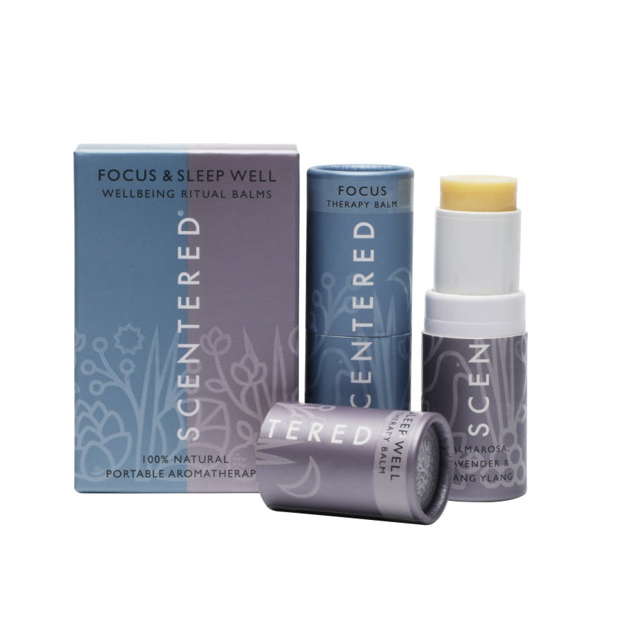 Two aromatherapy balm sticks from Scentered, namely the “Focus Therapy Balm” and “Sleep Well Therapy Balm,” come with their packaging. These are 100% natural, portable aromatherapy products.
