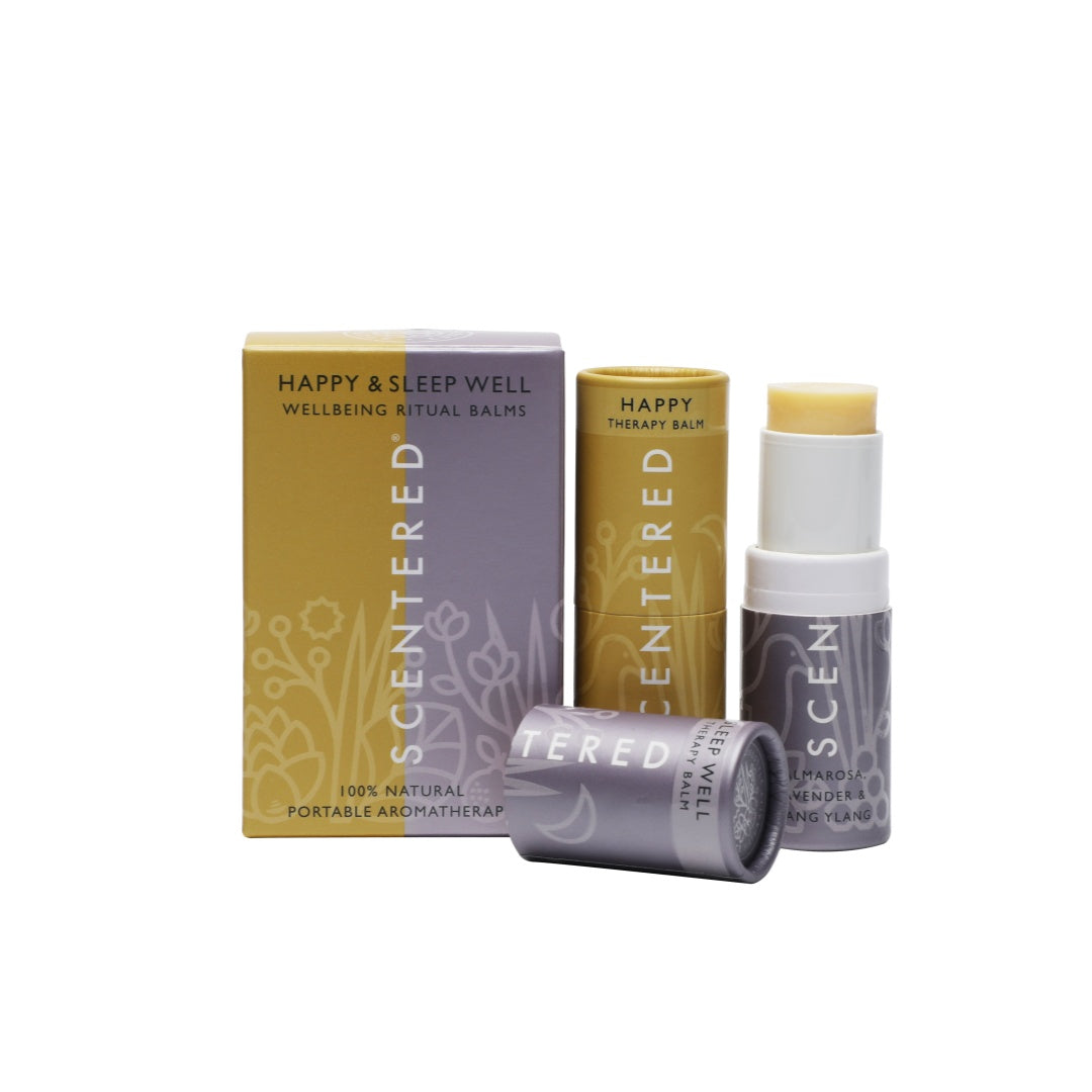 Two aromatherapy balm sticks by Scentered, namely the "Happy Therapy Balm" and "Sleep Well Balm," are presented alongside their packaging. These 100% natural, portable aromatherapy products are designed for enhancing well - being rituals.