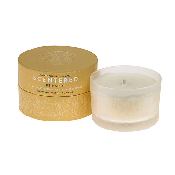 The Scentered Happy Aromatherapy Travel candle next to its packaging, infused with mood-enhancing essential oils, this Happy candle promotes positivity and joy.