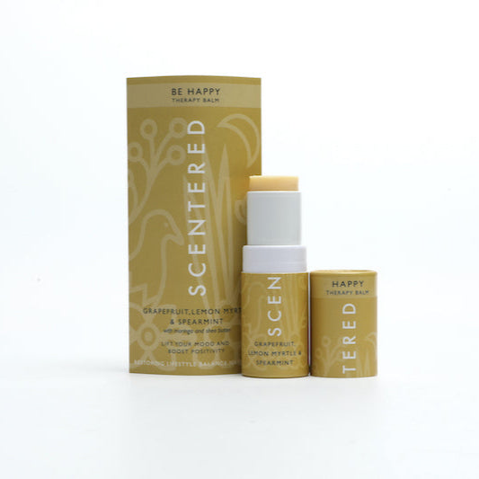 Happy Aromatherapy Balm with cap off and twisted up with eco sleeve packaging, uplifting aromatherapy balm stick by Scentered, formulated to enhance mood and promote positivity throughout the day.