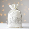 Reusable cotton drawstring bag, an eco-friendly alternative to traditional gift wrap, perfect for sustainable gifting.