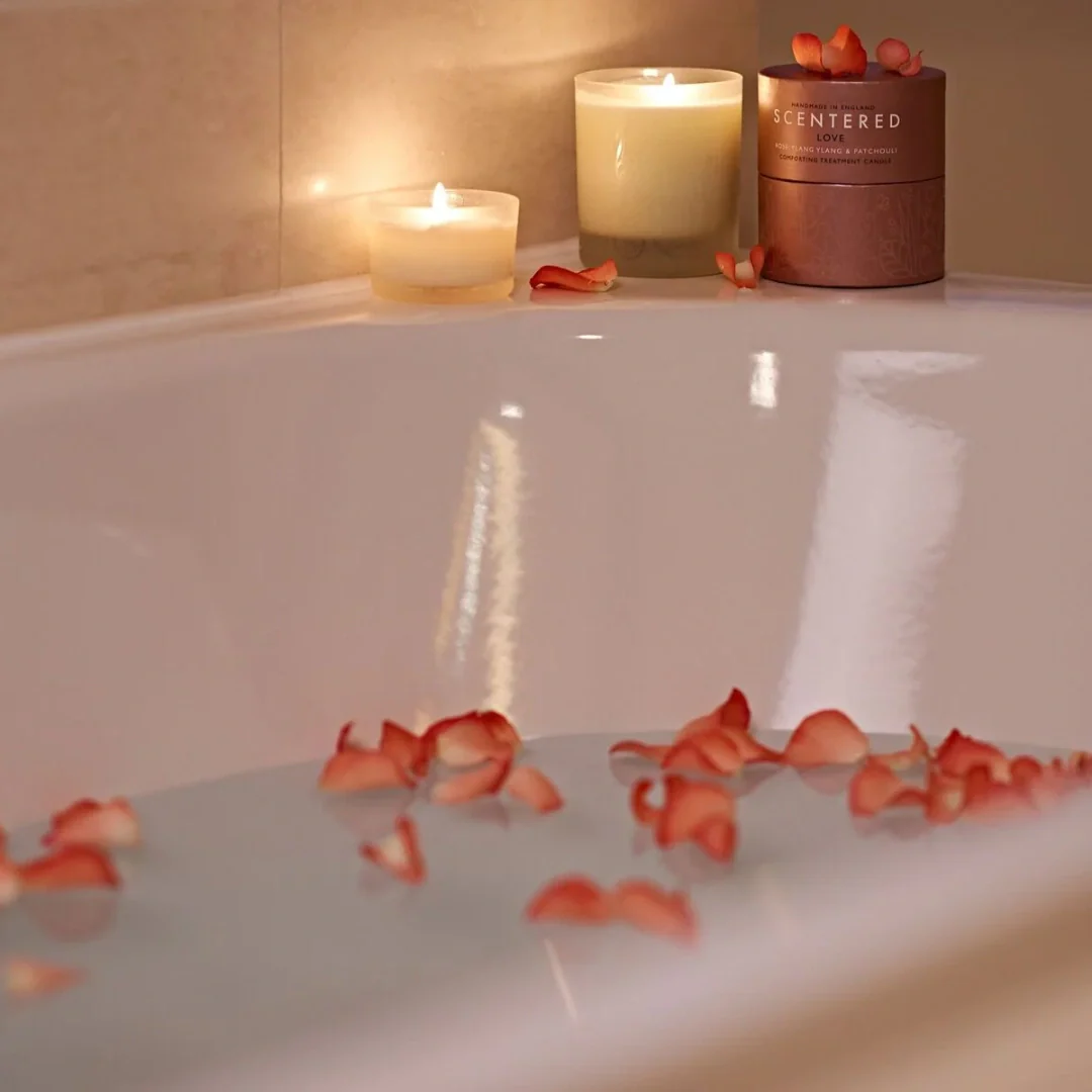 Love balm candle sitting on the bathtub