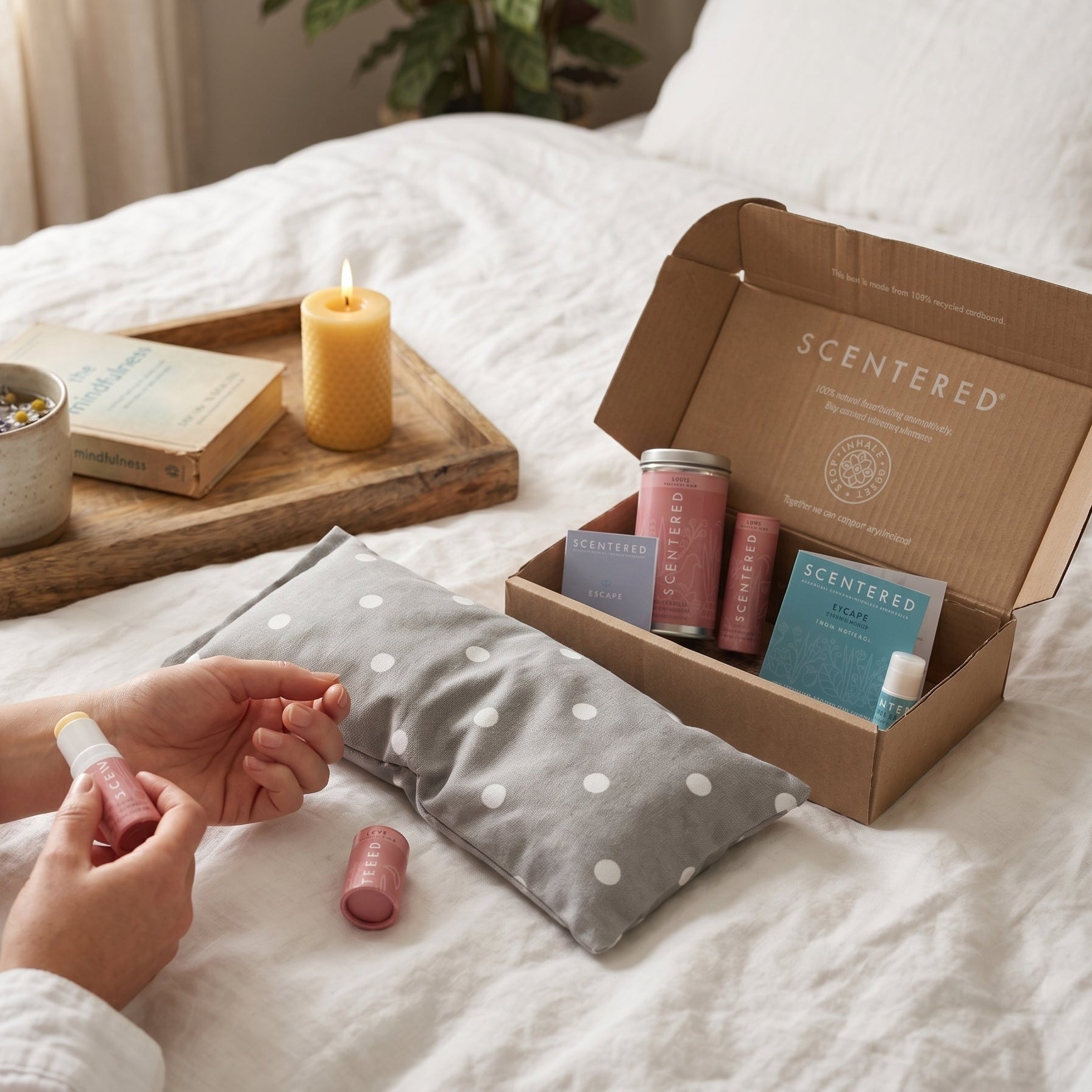 Aromatherapy stress relief gift set with calming essential oil balms and a soothing wheaty bag.