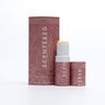 Love Aromatherapy Balm with cap off and twisted up with eco sleeve packaging on a white background, romantic floral aromatherapy balm for love, love Therapy Balm by Scentered, a romantic floral blend crafted to inspire feelings of love and emotional connection.