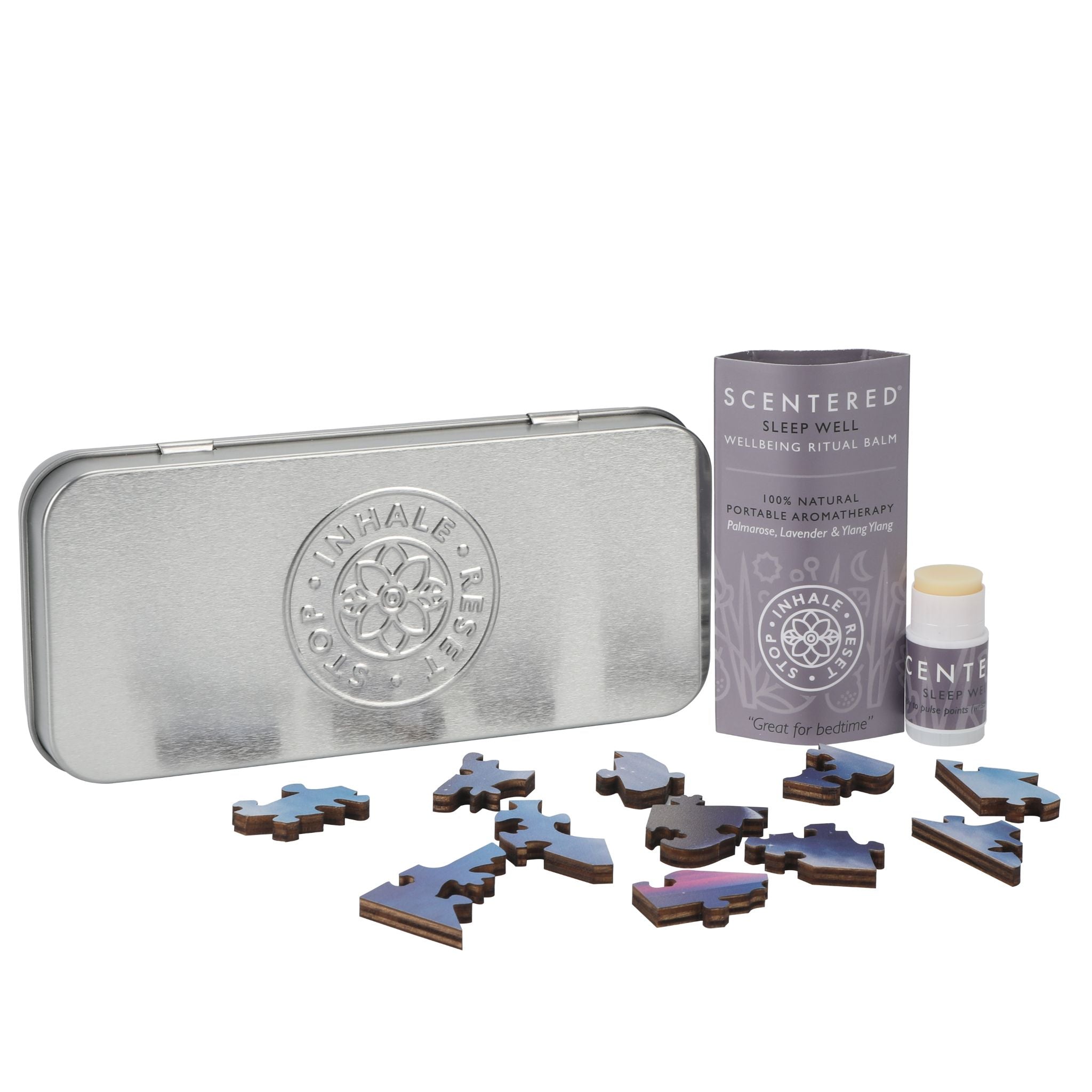 Scentered Sleep well mini balm, Jigsaw puzzle and metal reusable tin laid out on a white background