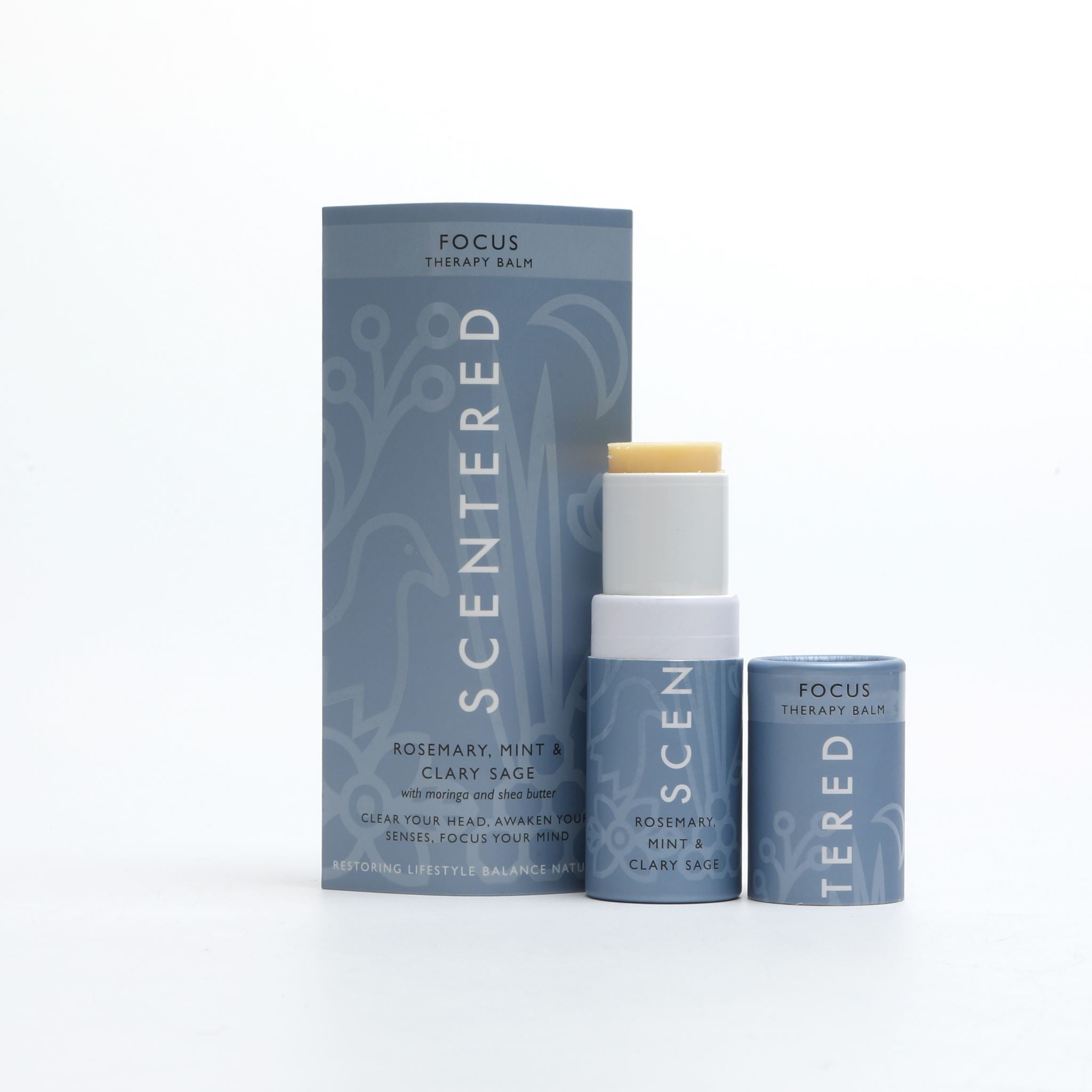 Focus Aromatherapy Balm with cap off and twisted up with eco sleeve packaging on a white background. Invigorating Focus Balm for Mental Clarity and Focus
