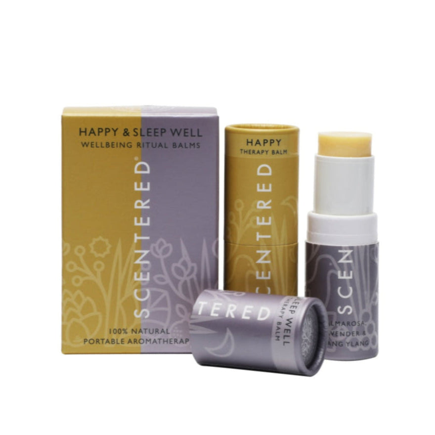 Two aromatherapy balm sticks by Scentered, namely the "Happy Therapy Balm" and "Sleep Well Balm," are presented alongside their packaging. These 100% natural, portable aromatherapy products are designed for enhancing well - being rituals.