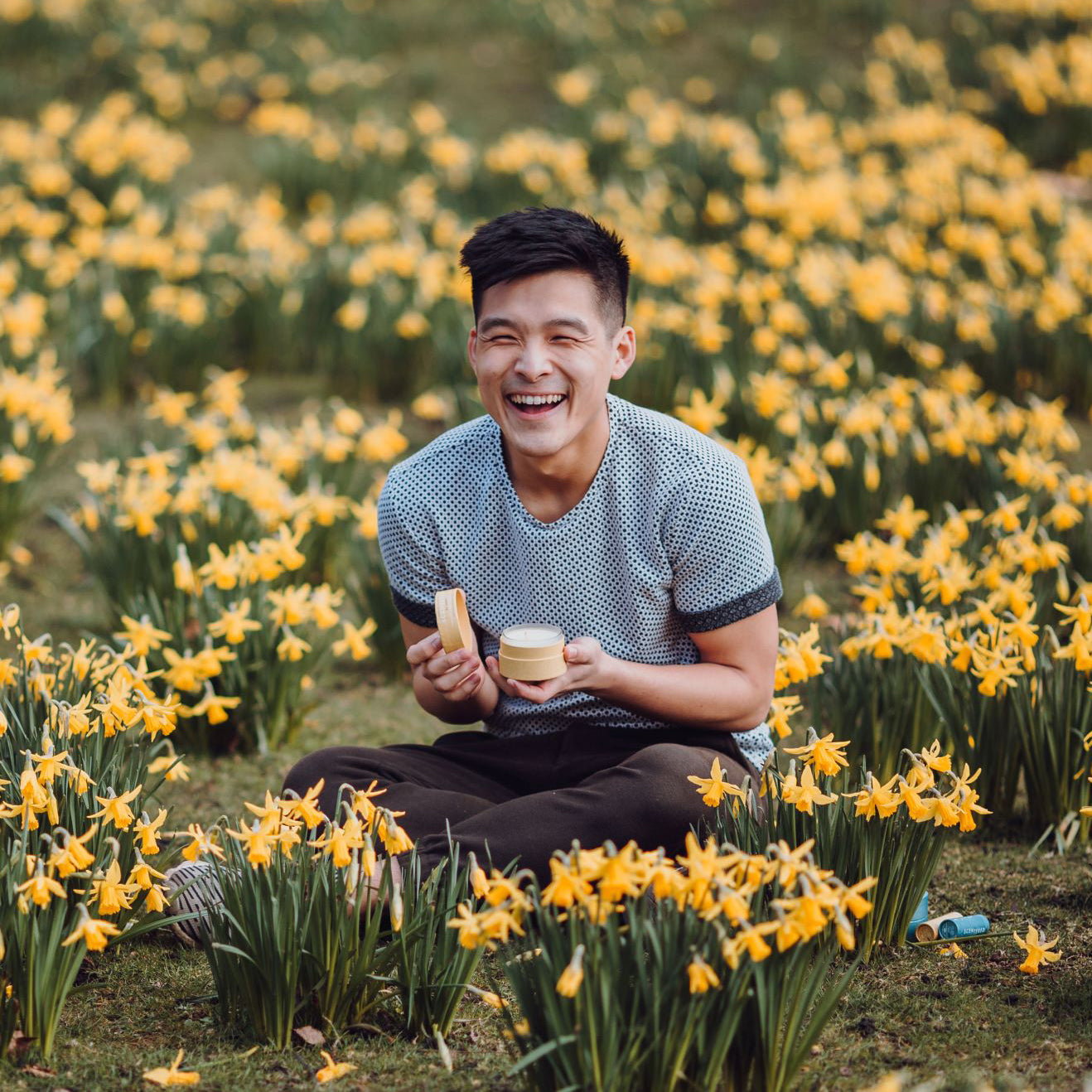 Uplift Your Mood - Man Applying Happy Aromatherapy Balm and using happy scent candle. Refreshing Moment with a Smile