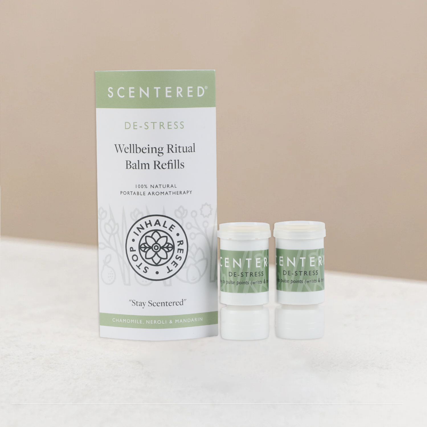 Scentered wellbeing ritual de-stress balm refills on a warming background.