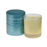 Escape home candle next to its packaging, Escape Essential Oil Candle for Relaxation