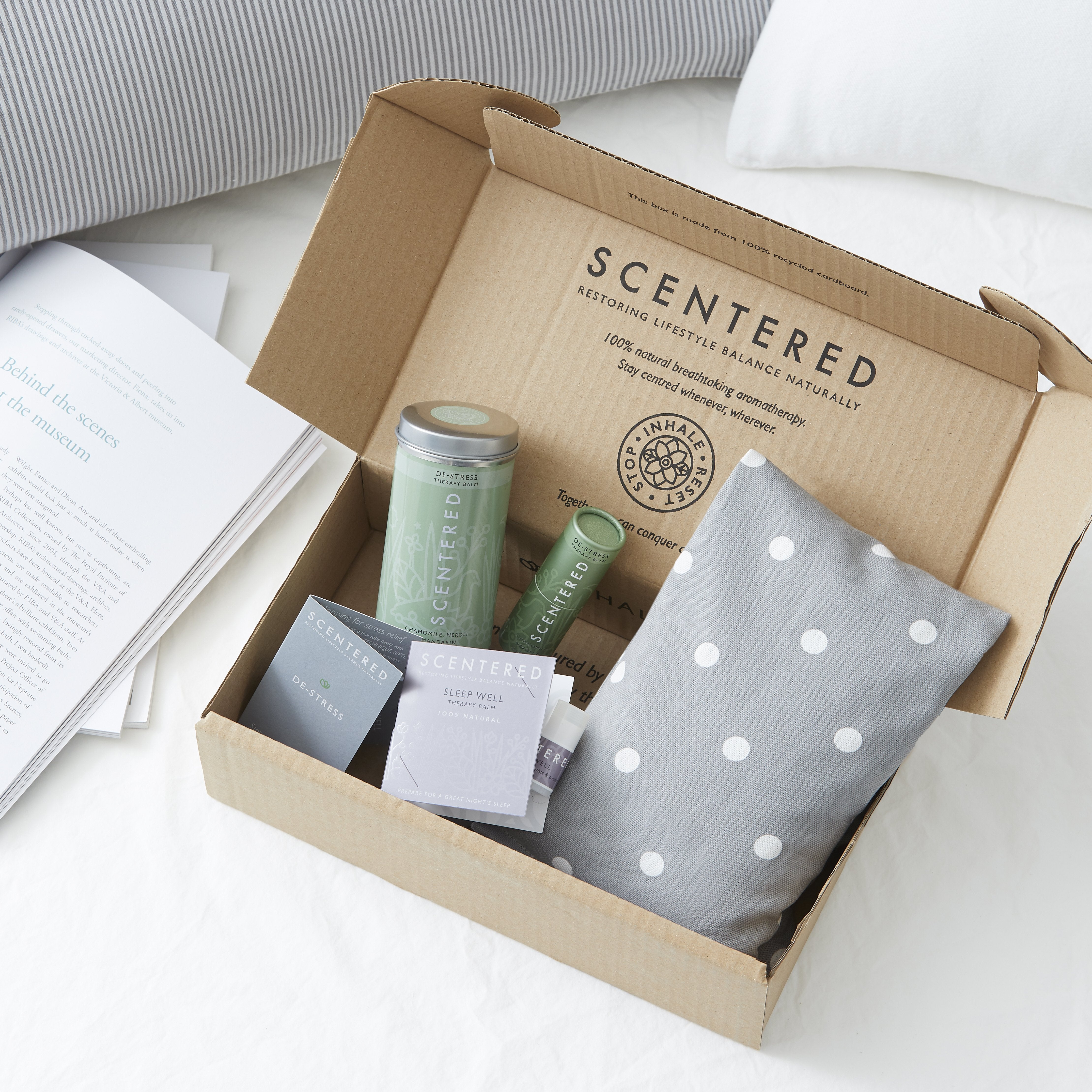 A Scentered branded box containing the Scentered De-stress Relaxation Set which includes a De-stress tin Balm, Wheat bag and Sleep Well mini balm.